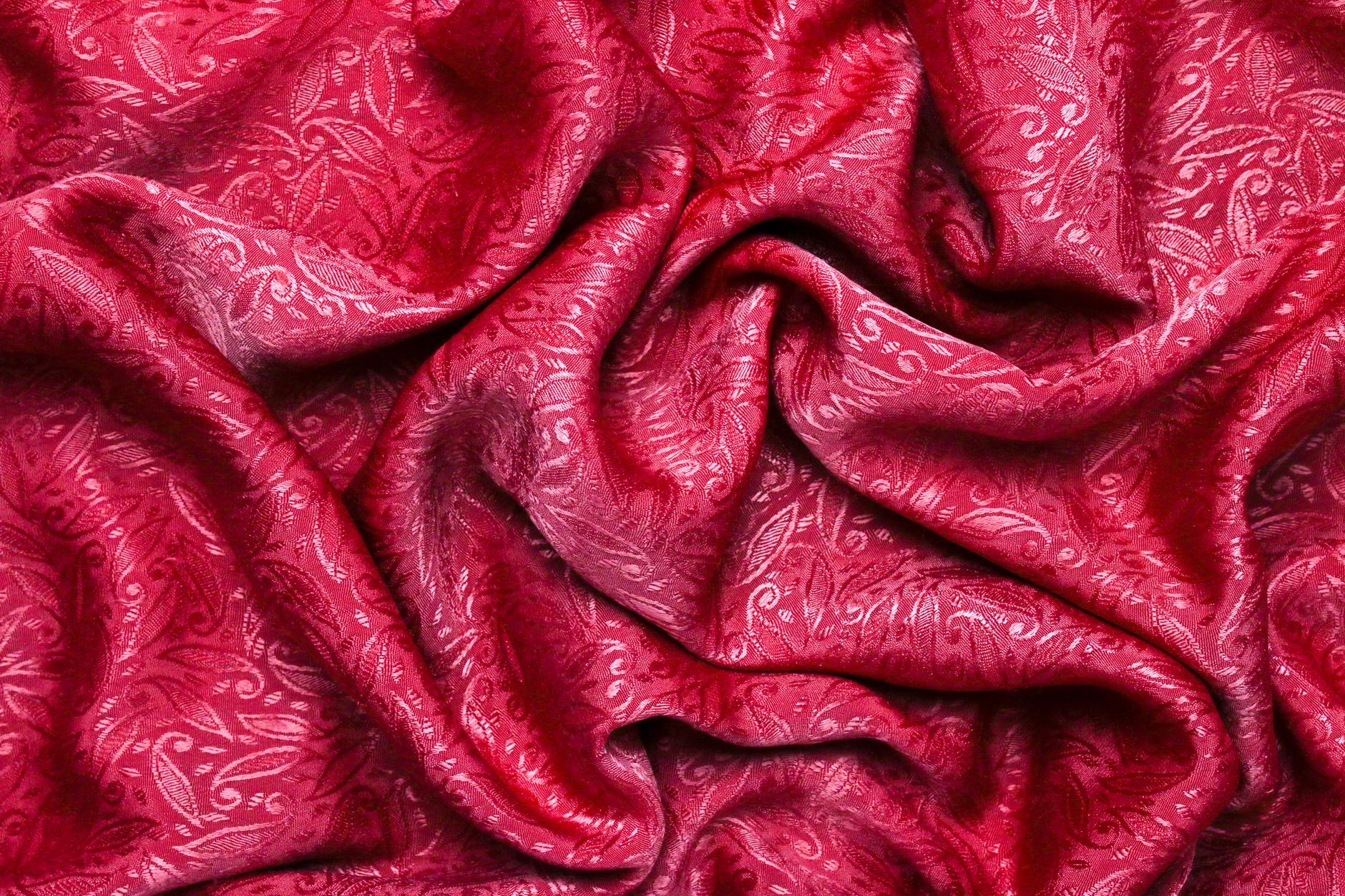 creased red fabric in close up photography